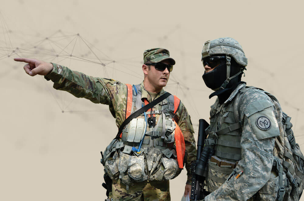 N.Y. National Guard Soldier, MSG Scott Kyle, assigned to headquarters, 106th Regional Training Institute, identifies a student's target during a field training exercise on the Camp Smith Training Site, Cortlandt Manor, N.Y.