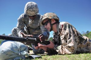 U.S. and German Soldiers prep for a shot during the competition.