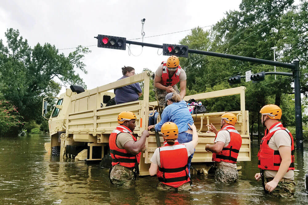 Soldiers with Texas Army National Guard rescue Houston residents as floodwaters from Hurricane Harvey continue to rise.