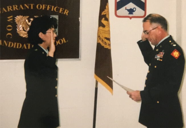 CW5 Bryan is sworn in as a warrant officer in November 1999.