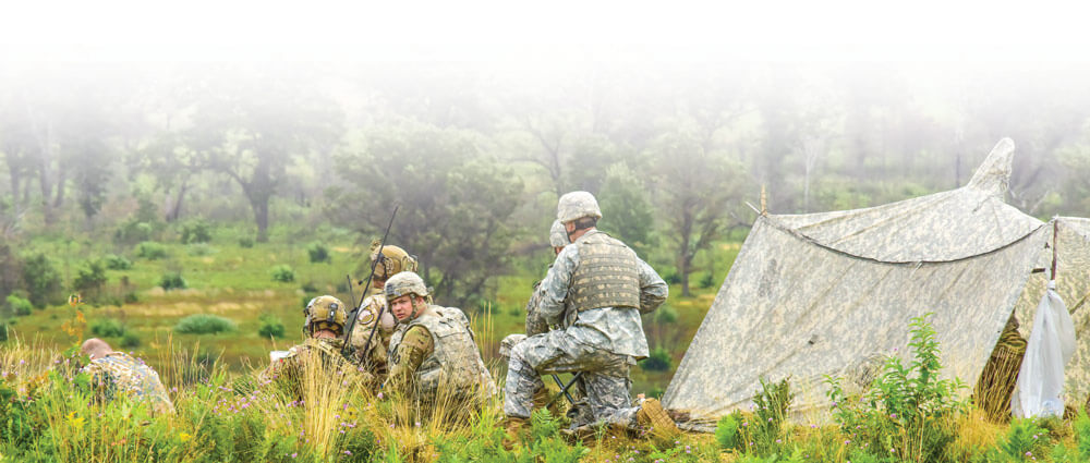 Joint team of JTAC airmen from the 227th Air Support Operations Squadron, New Jersey Army National Guard, the 146 Airlift Wing, California Air National Guard and Latvian soldiers man an exercise observation point.