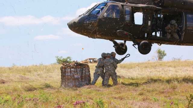 Soldiers From The Tennessee National Guard’s Regimental Support Squadron, 278th Armored Cavalry Regiment, perform sling load operations on Black Hawks from the Minnesota National Guard’s 2-147 Assault Helicopter Battalion during an exportable Combat Training Capability exercise at Fort Hood, Texas.