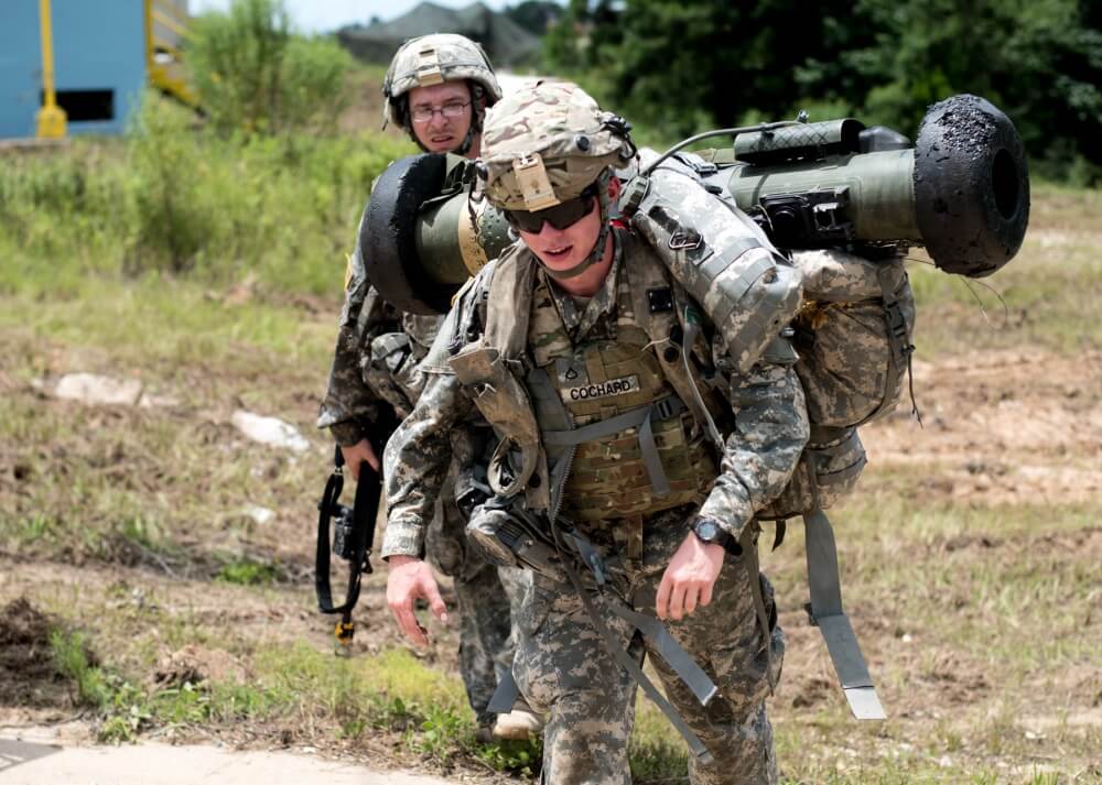 Indiana National Guard Pfc. Levi Cochard, with the 113th Brigade Support Battalion, carries an AT-4, anti-tank weapon, doing the the 76th Infantry Brigade Combat Team's rotation at the Joint Readiness Training Center.