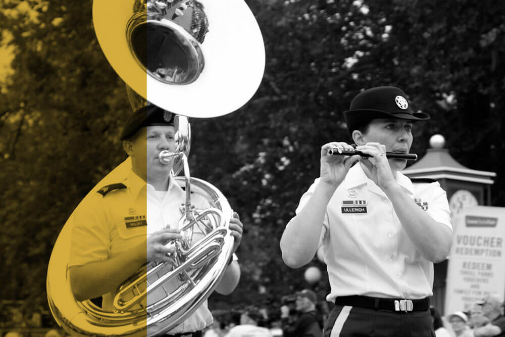 The 34th Army Band Concert and Marching Band performs in an Iowa State parade.