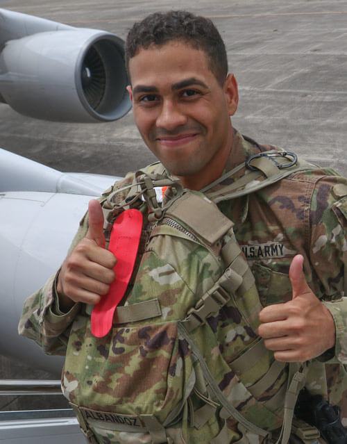 A Soldier of the 3ID MCPOD gives a thumbs-up as he boards a plane to deploy to Afghanistan.