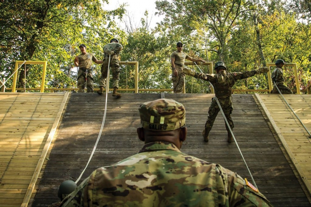 Army air assault students learn rappelling techniques during a class at the Army National Guard Warrior Training Center at Camp Dawson in Kingwood, W.Va.