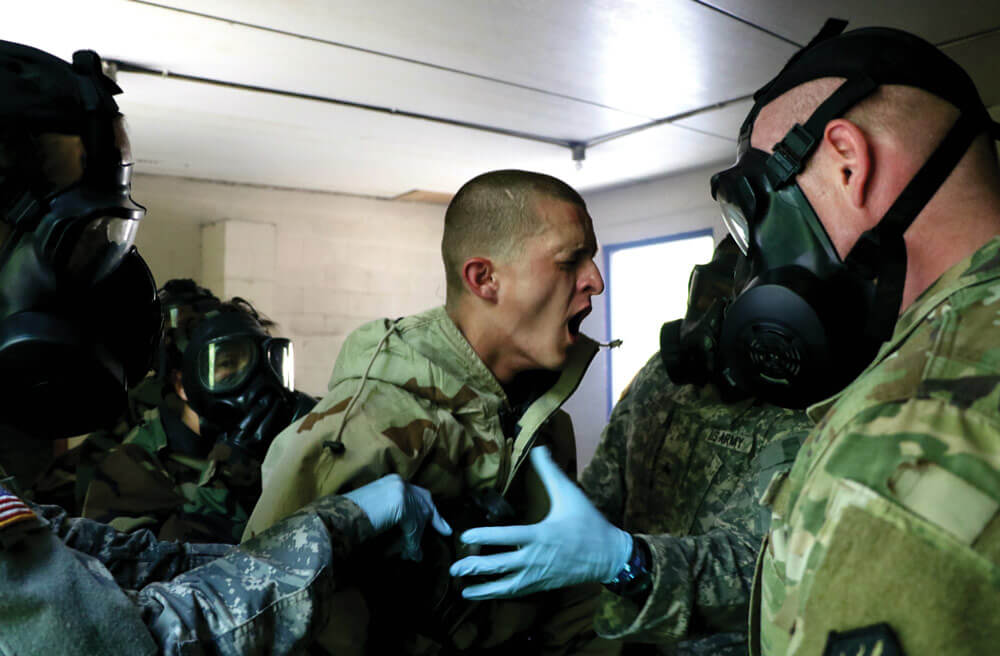 Alpha Company Cadets finish CBRN threat training by braving the gas chamber in the CBRN Defense Mask Confidence Course.