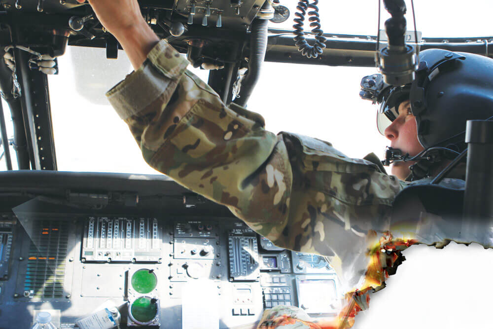 CW2 McKayla Dembowski, as assistant pilot from the 1106th Theater Aviation Sustainment Maintenance Group, drops water from her UH-60 Black Hawk as part of the firefight against the wildfires.