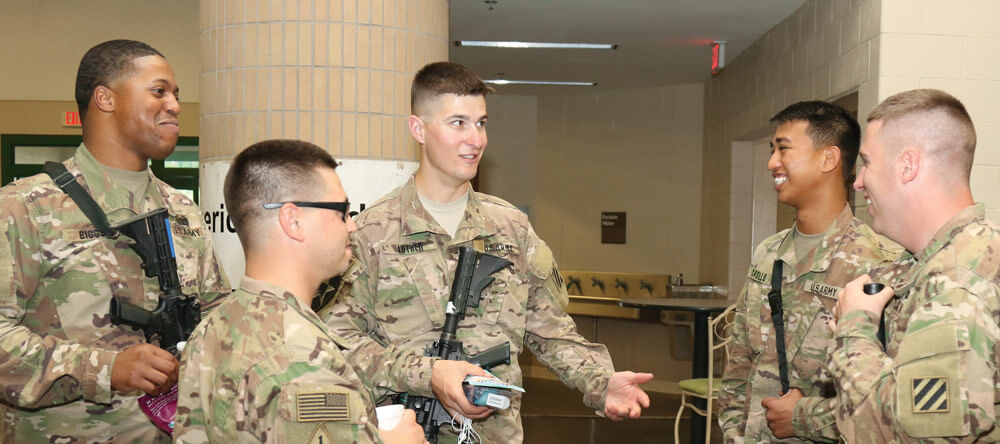 Soldiers of 3rd Infantry Division Headquarters relax in the terminal at the Hunter Army Airfield, Ga. prior to deploying to Afghanistan. The recreational time is an opportunity for Soldiers to decompress and build connections with one another. Developing these types of connections is a key factor in helping to deter or detect suicidal behavior shown by a colleague.