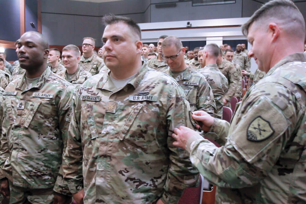 Members of the Virginia National Guard’s newly-activated Bowling Green-based 91st Cyber Brigade receive their new shoulder sleeve insignia at Fort Belvoir, Va.