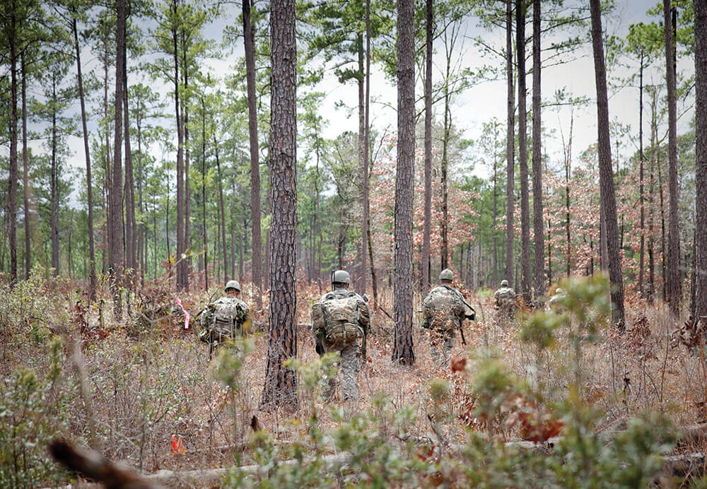 Soldiers move through the woods of the Echo Training Area during the final training exercise of the Ranger Training Assessment Course. U.S. Army Maneuver Center of Excellence photo by Ashley Cross.