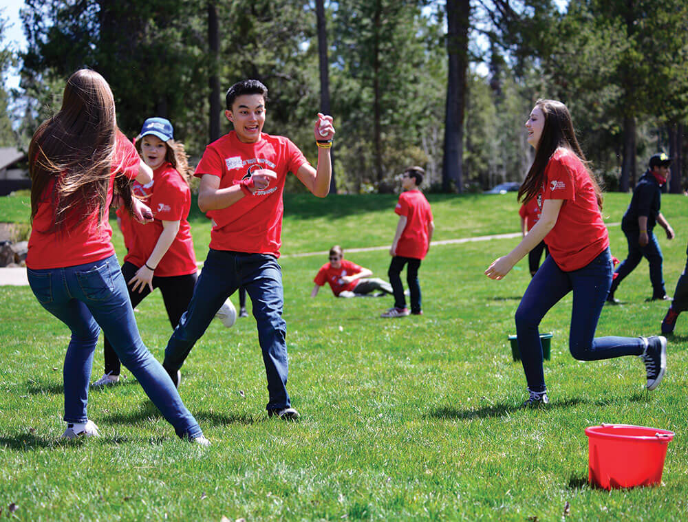 Oregon National Guard Youth Symposium participants run during a 4-H Zombie Skills Challenge game. Oregon Army National Guard photo by CPT Leslie Reed