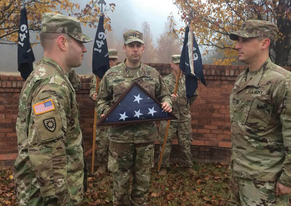 The Huron, Apache and Dakota Companies, Kentucky Army National Guard, complete the flag casing ceremony in Pineville State Park as part of the Mountain Warrior Memorial Ruck March. Photo courtesy of Kentucky Army National Guard.