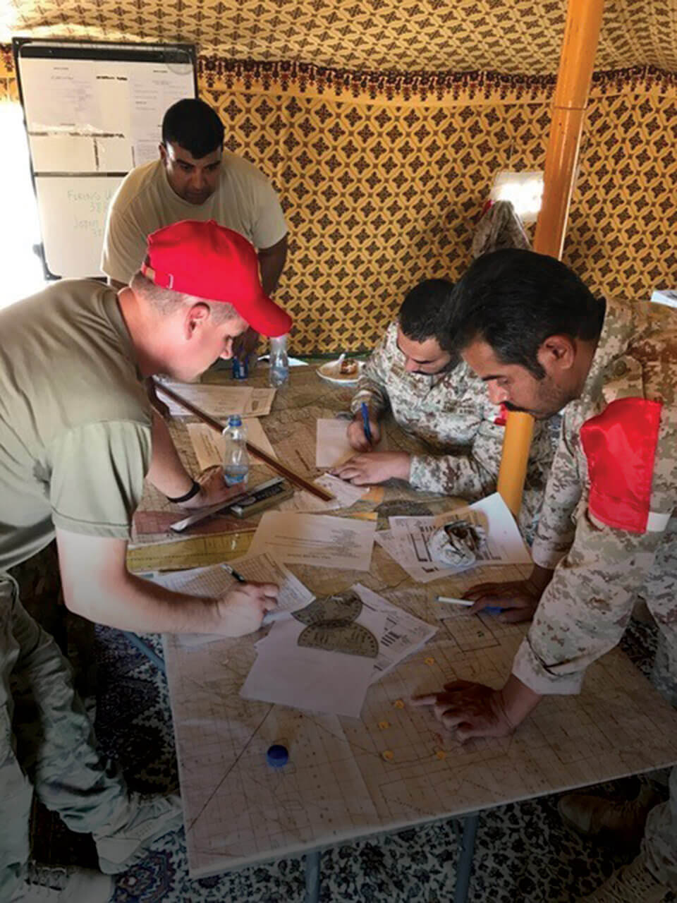 Soldiers of the 169th Field Artillery Brigade process a call-for-fire from Kuwaiti soldiers of the 22nd Battalion, Kuwaiti Land Forces, during Operation Spartan Thunder. Army National Guard photo by SSG Jeremy Miller.