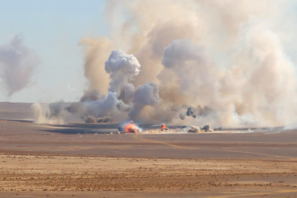 U.S. and Jordanian Army artillery explode after impact during a training exercise outside of Amman, Jordan. Army National Guard photo by SSG Jeremy Miller.