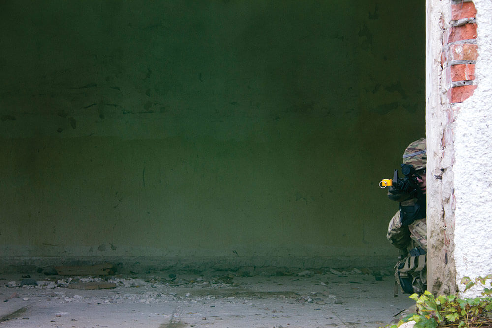 SPC Jeremy Pisciotta of Headquarters and Headquarters Company, 1st Battalion, 279th Infantry Regiment, provides security during the Basic Leader Course field training exercise at the Yavoriv Combat Training Center. Oklahoma Army National Guard photo by SGT Anthony Jones.