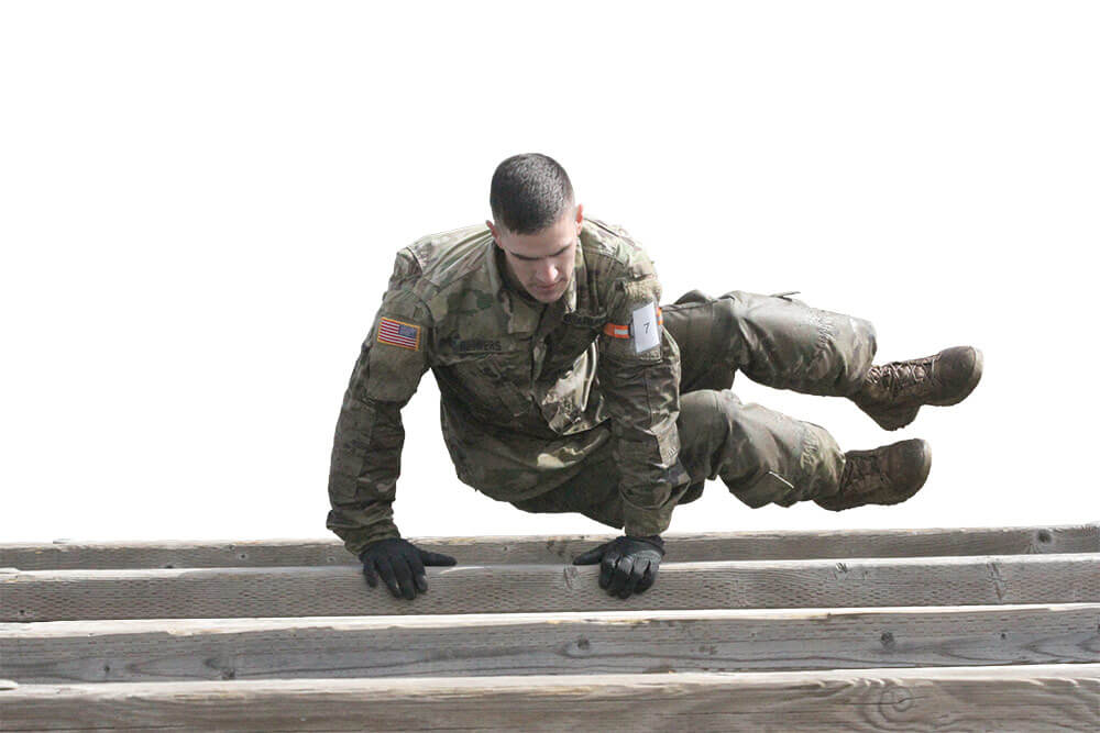 SGT Grant Reimers hurdles through side jumps in the obstacle course event during the 2017 Army National Guard Best Warrior Competition. Army National Guard photo by SSG Edward Siguenza.