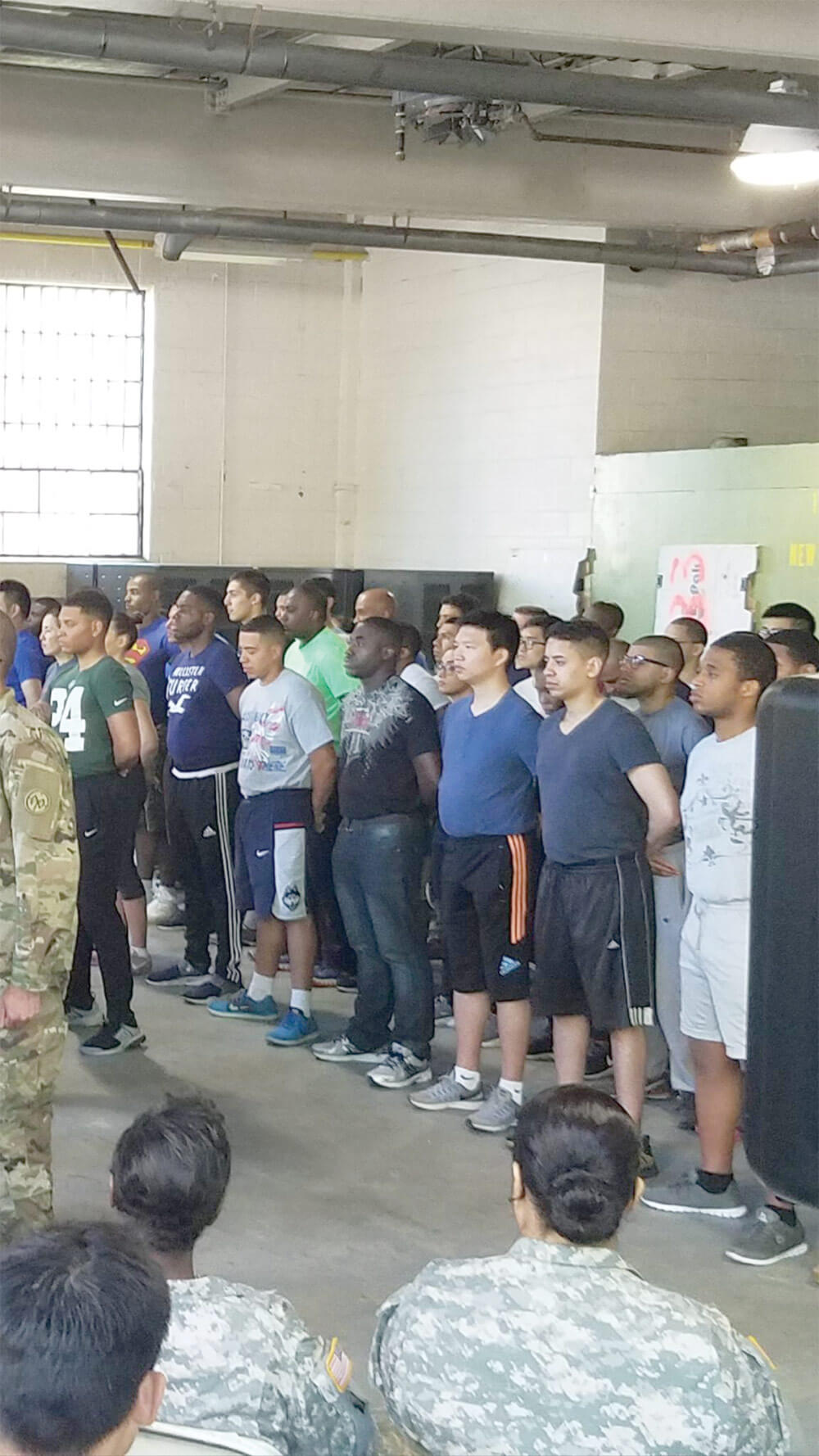 PFC Mensah shown in formation during a Battle Hand off Ceremony at a Recruit Sustainment Program site in the Bronx, N.Y. Photo courtesy of the New York Army National Guard.