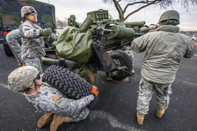 New Jersey Army National Guard Soldiers prepare an M119A3 howitzer for a 19-gun salute as part of the inauguration ceremony for New Jersey Gov. Phil Murphy at the War Memorial in Trenton, N.J., Jan. 16, 2018. New Jersey National Guard photo by Mark C. Olsen.