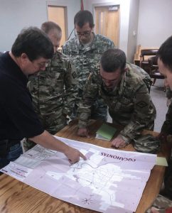 Soldiers of the 87th Troop Command receive information from local authorities on Pocahontas’ critical areas in need. Photos courtesy Arkansas Army National Guard