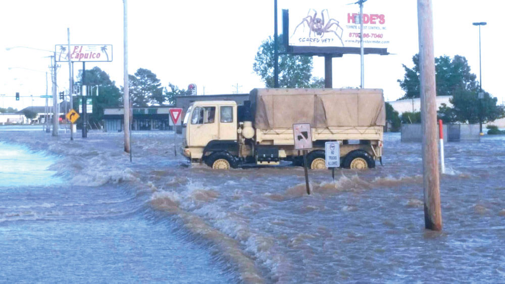 Using a high-water rescue vehicle, Soldiers patrol flooded streets in the small town of Pocahontas, Ark. Photos courtesy Arkansas Army National Guard