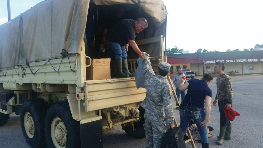 SFC Brandon Hassell assists in the evacuation of residents of Pocahontas. Photos courtesy Arkansas Army National Guard