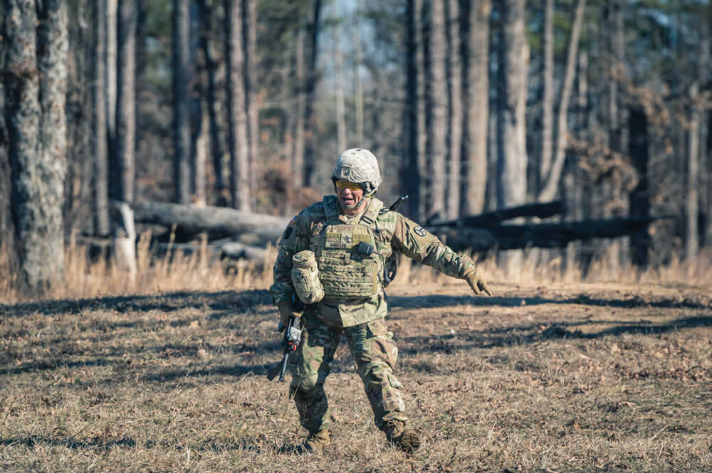 SSG Steven Angeles gives orders to Soldiers of the 3rd Squadron, 278th Armored Cavalry Regiment, as they complete the live fire exercise portion of the unit's qualification held at Fort Pickett.