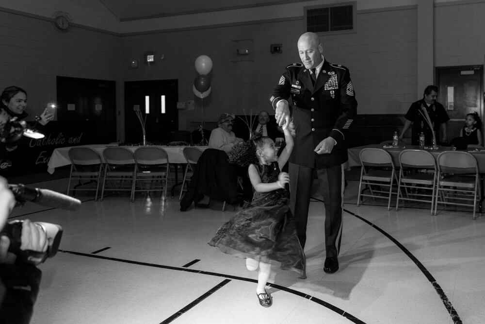 Cayleigh Hinton, daughter of the late SGT Terrence Hinton, dances with 1SG Joseph Bierbrodt, at her school’s father-daughter dance. Illinois Army National Guard photos by SSG Robert R. Adams