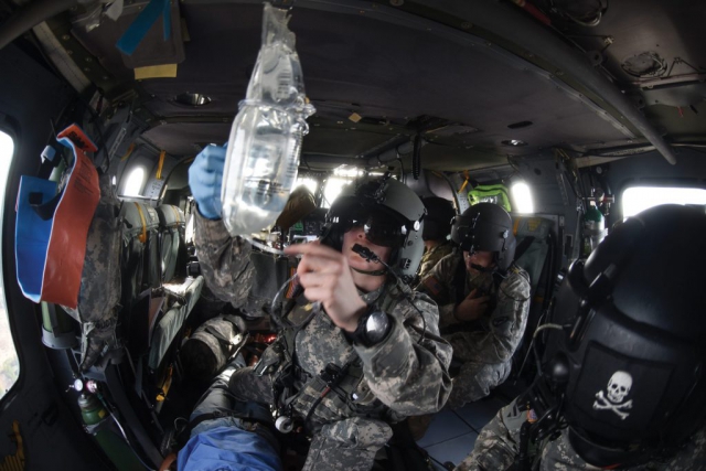 South Carolina Army National Guard SGT Jamie Hair, a critical-care flight paramedic, and SGT Brandon Waltz, crew chief, respond to notional “9-line MEDEVAC” calls during their Annual Training at Army Aviation Support Facility-Location Number 2 in Eastover, S.C. South Carolina Army National Guard photo by SSG Roberto Di Giovine