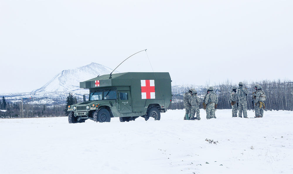 Medics from the Alaska Army National Guard stand ready to render assistance to Soldiers potentially suffering from cold weather-related injuries at Fort Greely, Alaska.