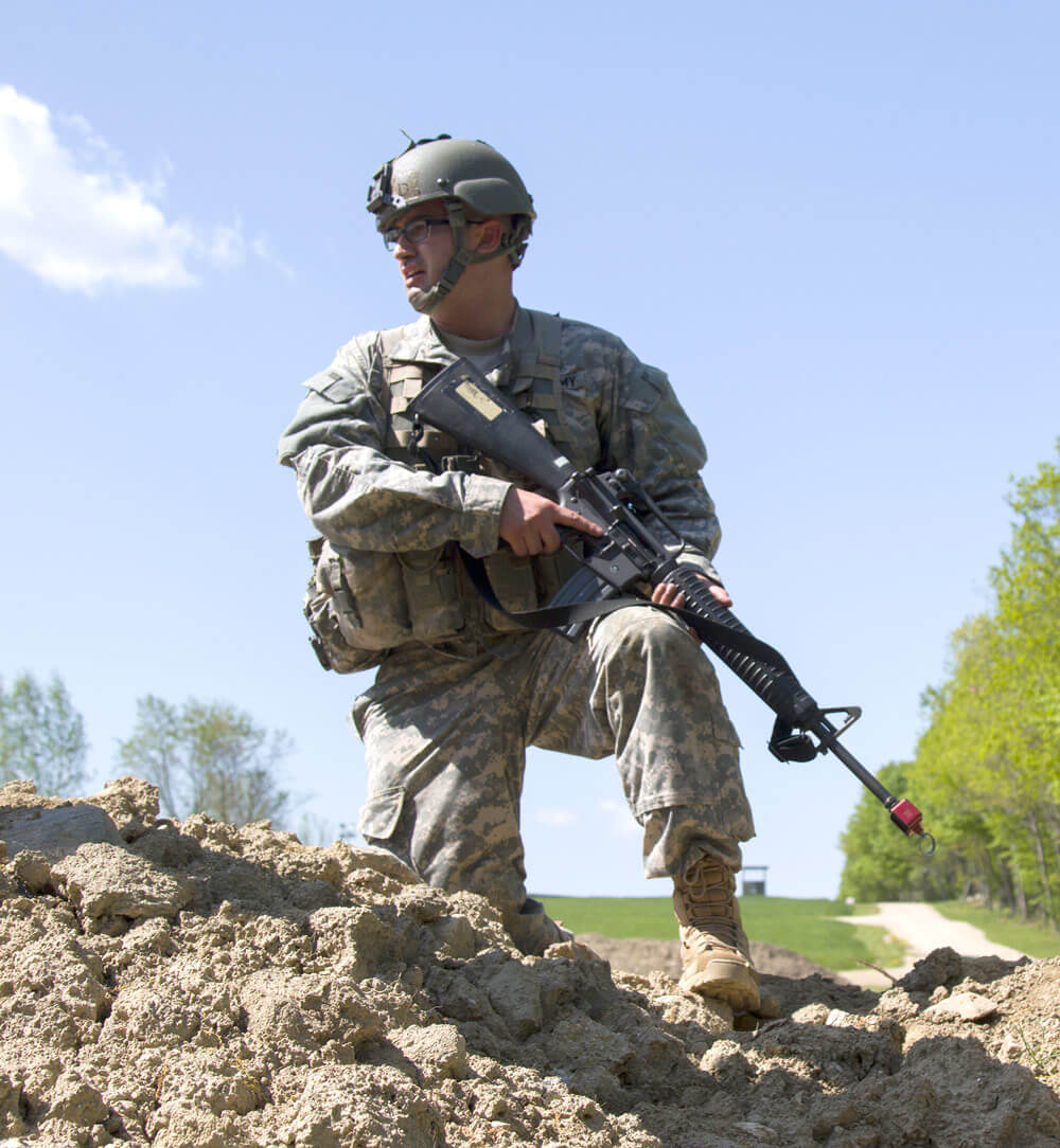 An Army National Guard officer candidate observes Soldiers clearing a make-shift bunker during an OCS Field Leadership Exercise at the New Hampshire National Guard Training Site in Center Strafford, N.H.. Vermont Army National Guard photo by SPC Avery Cunningham