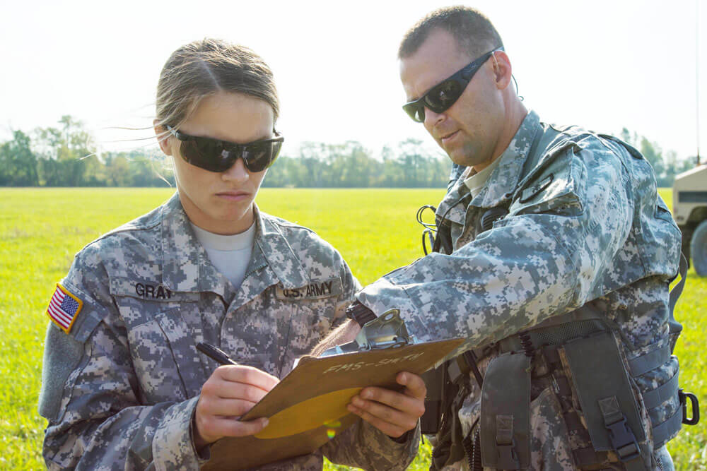 SGT Marina Gray conducts sling load training with a UH 60L Black Hawk Helicopter as part of her company’s annual training at Camp Dodge, Iowa. Maine Army National Guard photo by SGT Sarah Myrick