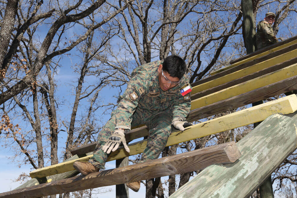 Chilean Army Spc. Luis Miguel Penchulef descends “The Weaver” obstacle during the Texas Military Department’s Best Warrior Competition at Camp Swift, Texas, March 1, 2018. Texas National Guard photo by SGT Mark Decker