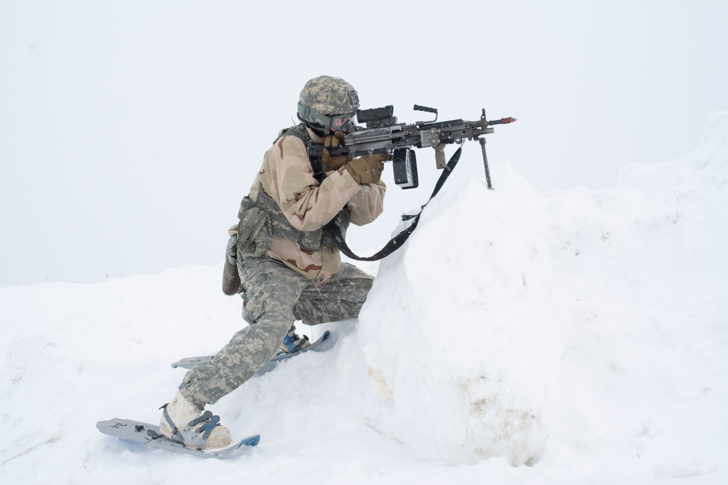 An Alaska Army National Guard Soldier lines up his shot as he plays the role of OPFOR during a notional attack at the Murphy Dome Long Range Radar Site near Fairbanks, Alaska. The scenario was part of Arctic Eagle 2018 – a cold-weather training exercise hosted by the Alaska Army National Guard. It was held Feb. 20 – March 8 and took place at multiple locations across Alaska including Fairbanks, Valdez, the Alaska/Canada Boarder, Joint Base Elmendorf–Richardson, and Fort Greely. National Guard Bureau photo by Lauren di Scipio