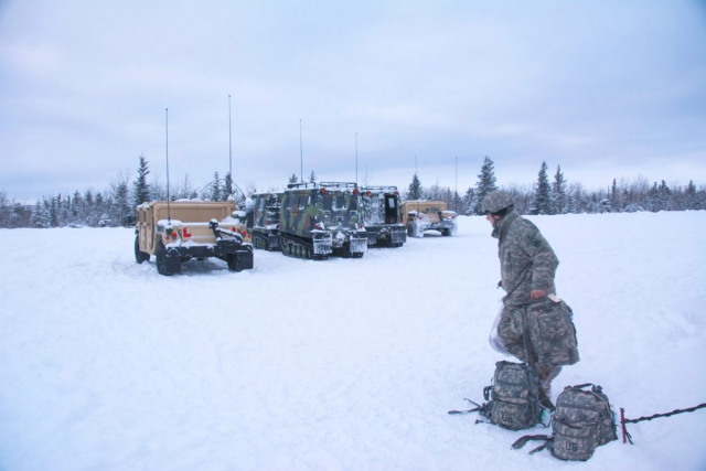 A Soldier from the 29th Infantry Brigade, Hawaii Army National Guard prepares to load supplies onto a HMMWV at Fort Greely, Alaska after a snow storm during Arctic Eagle 2018. Arctic Eagle was a cold-weather training exercise hosted by the Alaska Army National Guard. It was held Feb. 20 – March 8 and took place at multiple locations across Alaska including Fairbanks, Valdez, the Alaska/Canada Boarder, Joint Base Elmendorf–Richardson, and Fort Greely. National Guard Bureau photo by Lauren di Scipio