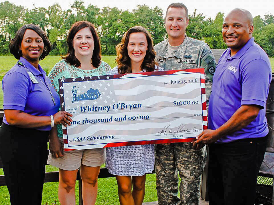 Shelia Brookins (far left) and SFC Darrell Brookins (far right) pose for a photo with 2016 USAA Scholarship winner Whitney O’Bryan and her parents as they present O’Bryan with her scholarship check, July 12, 2016. Photos courtesy Enlisted Association of the National Guard of Kentucky