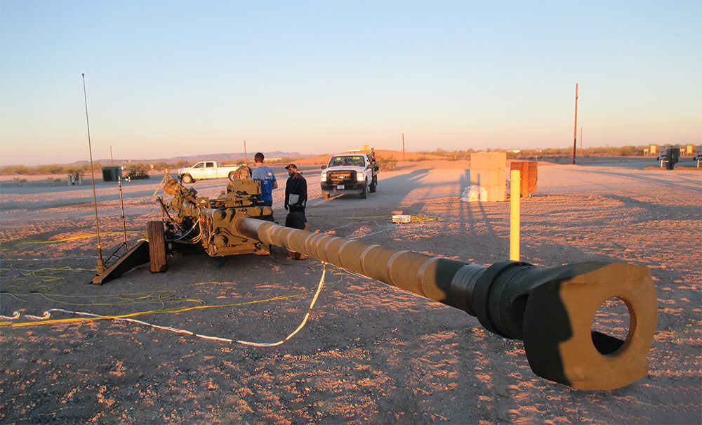 ARDEC engineering staff members conduct pre-fire checks and daily preventative maintenance in advance of a live-fire test of the Extended Range M777A2 held at Picatinny Arsenal. Photo courtesy U.S. Army