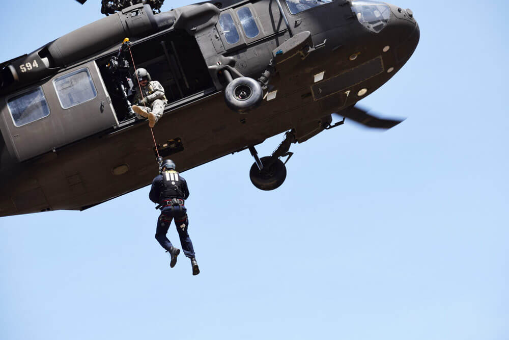 An Idaho Army National Guard UH-60 helicopter crew trains a firefighter with the Boise Fire Department’s water rescue team on hoist procedures during a joint domestic operations training, April 3, 2018. Idaho Army National Guard photo by CPT Robert Taylor