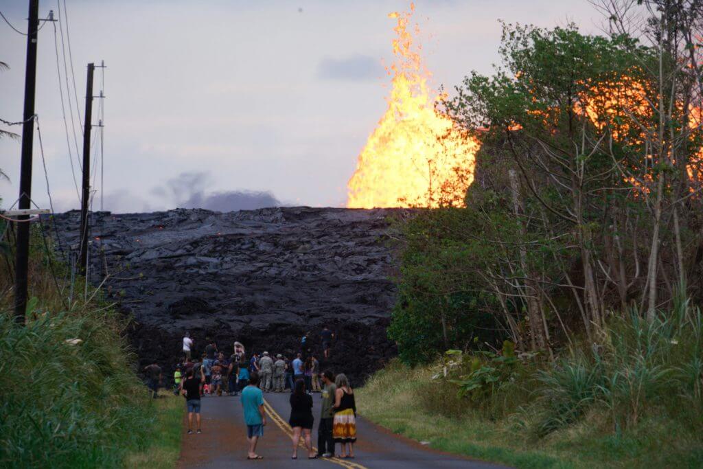 Members of the Hawaii Army National Guard monitor the press as they cover the activity at fissure number seven during a media escort mission at Leilani Estates, May 26, 2018. Joint Task Force 5-0 in Hawaii is helping authorities handle evacuations, provide security and monitor air quality as Mount Kilauea spews out clouds of toxic gas and lava destroys homes in its path. More than 150 National Guard troops volunteered for active duty to help with evacuations and to man checkpoints in front of the lava flow. To date, about 2,000 residents have been evacuated from their homes on the big island of Hawaii. Hawaii National Guard photo by TSgt Andrew Lee Jackson