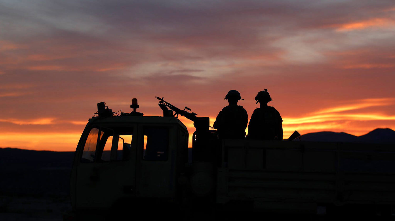 SGT Seamus Redmond and SPC Joseph Page, members of Task Force Ragnar, stand guard during a rotation at the National Training Center in Fort Irwin, California, May 8, 2018. Led by the Minnesota Army National Guard, Task Force Ragnar is made up by Soldiers from Utah-based B Company, 1st Battalion, 211th Assault Reconnaissance Battalion; Nevada-based B Company, 1-189th General Support Aviation Battalion; Michigan-based C Company, 3-238th GSAB; and Minnesota-based A, D, E and Headquarters Companies, 2-147th AHB and F Company, 1-189th GSAB. Minnesota Army National Guard photo by CPT Katherine Zins