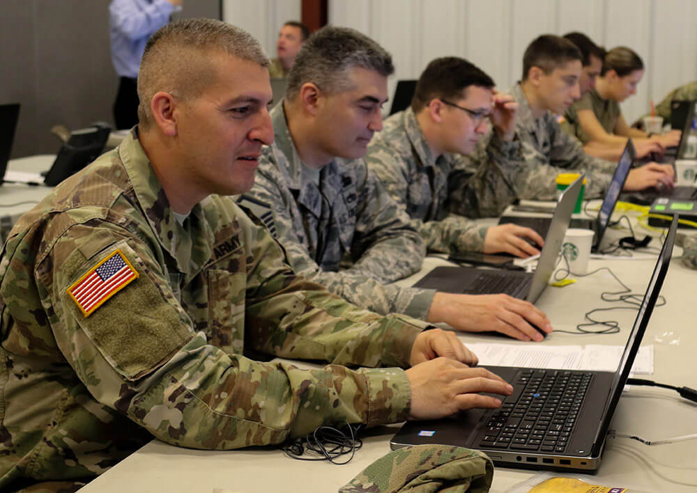 Soldiers and Airmen from around the country monitor network traffic for fictional malicious intrusion during Cyber Shield 18. Ohio Army National Guard photo by SSG Michael Carden
