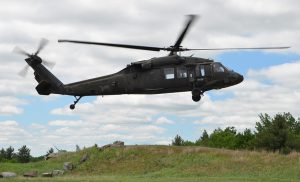 Soldiers of the 3rd Battalion, 142nd Aviation Regiment, fly over Fort Drum, N.Y., in a UH-60 Black Hawk Helicopter as part of their yearly air gunnery qualification exercise. New York Army National Guard photo by SPC Andrew Valenza