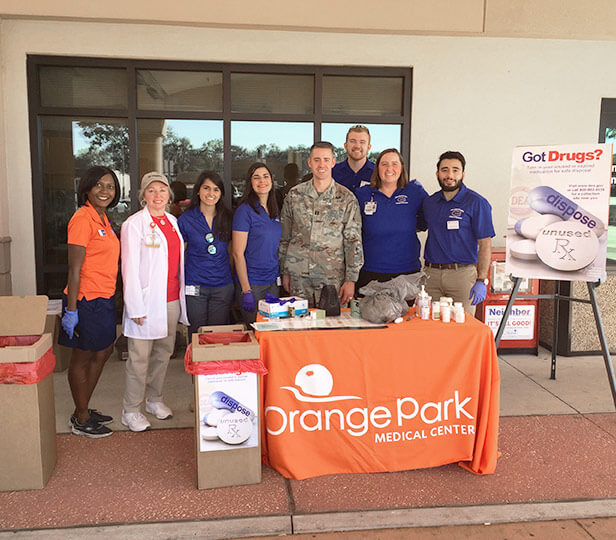 CPT Michael Coy with the Florida National Guard’s Counterdrug Program works with Orange Park Medical Center staff members during a “Take Back” event in Orange Park, Fla. Image courtesy Florida National Guard