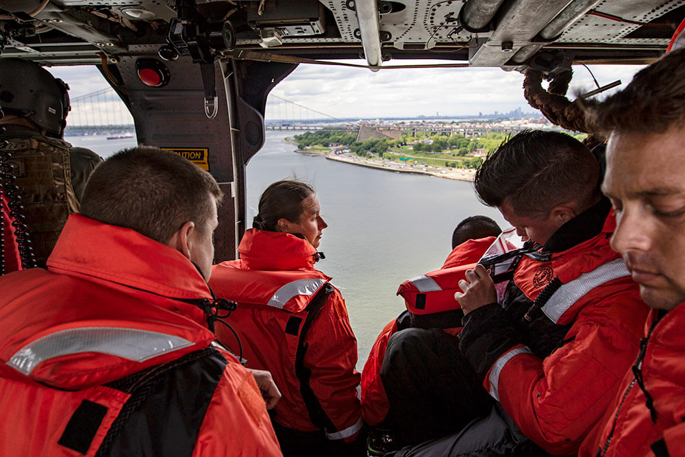 New York National Guard members of the 24th Weapons of Mass Destruction Civil Support Team prepare to helocast into Gravesend Bay off the coast of Long Island during their annual helocasting certification event held at Fort Hamilton, N.Y. New York Army National Guard photo by SPC Amouris Coss