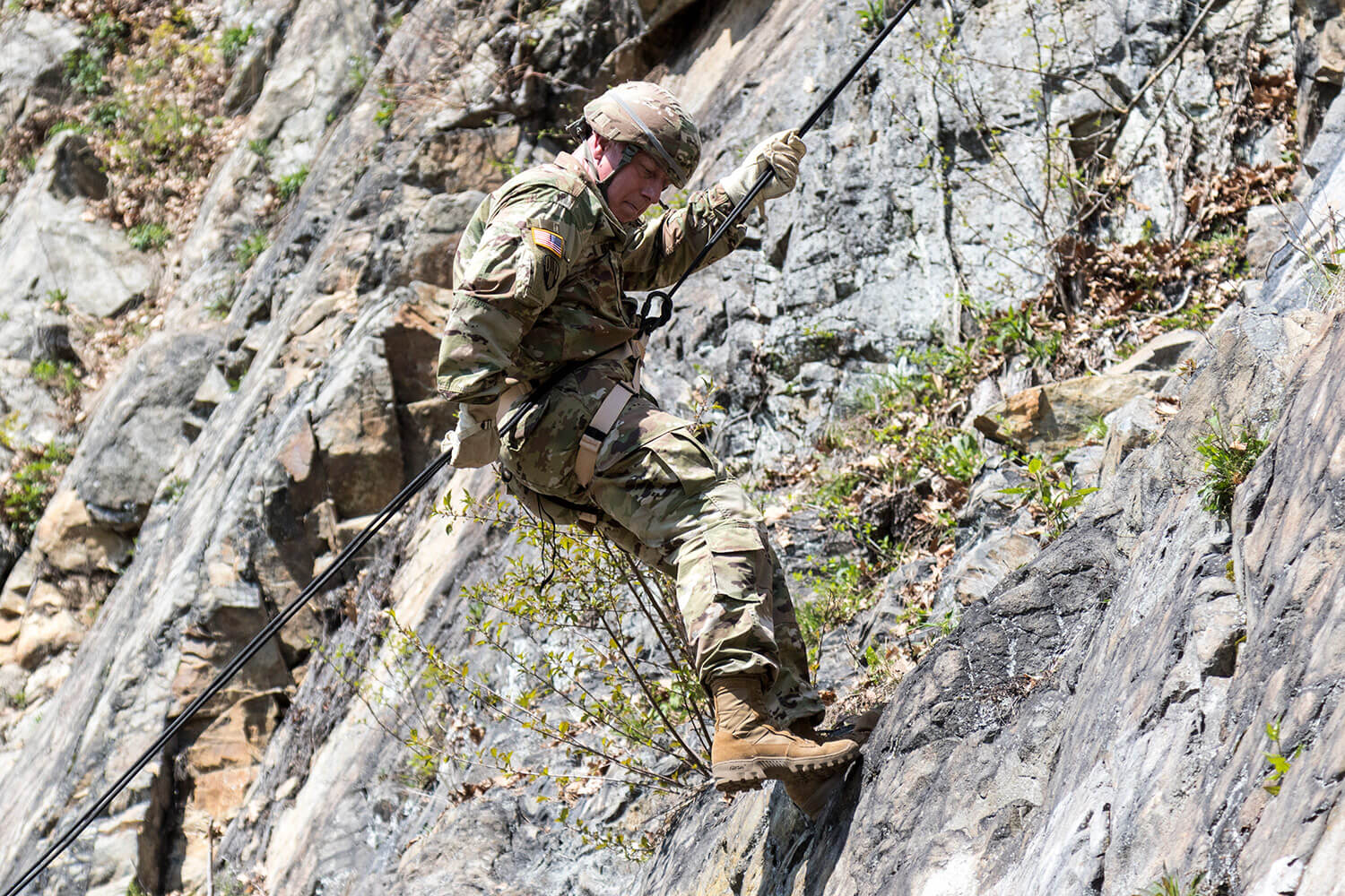 CW2 David Morton, range operations manager at Camp Smith, assigned to the 42nd Infantry Division, New York Army National Guard, navigates the terrain of a mountainside using one of the newly updated rappel lanes at Camp Smith Training Site in Cortlandt Manor, N.Y. New York Army National Guard photo by SSG Michael Davis