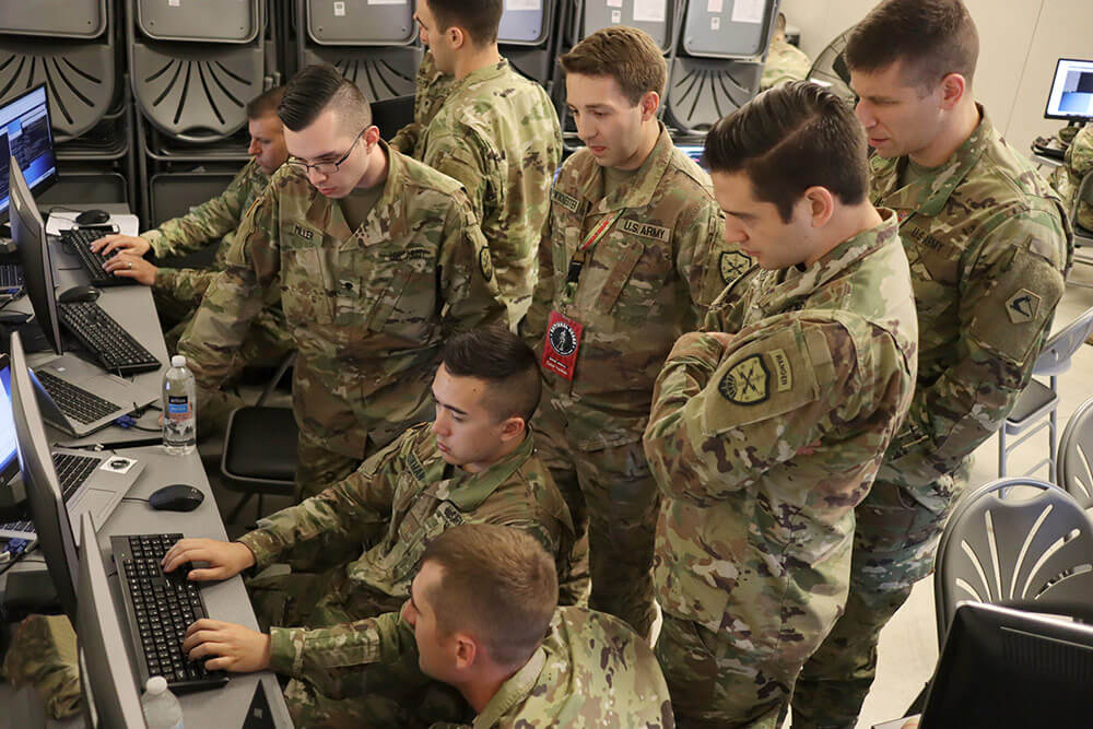 Fourteen Virginia National Guard Soldiers assigned to the 123rd and 124th Cyber Protection Battalions, 91st Cyber Brigade, take part in the Cyber Yankee network defense exercise June 2018, at Joint Base Cape Cod, Massachusetts. Virginia Army National Guard photo by Cotton Puryear