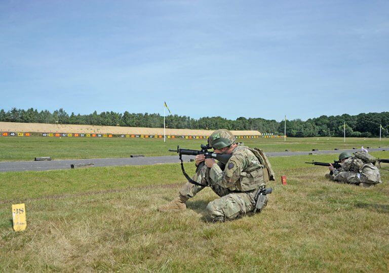 1LT Garrett Miller, All Guard International Combat Team member from the Pennsylvania Army National Guard, competes in the 2018 UK Defence Operational Shooting Competition as he engages his final targets situated 100 meters down range after running five 100-meter sprints, engaging targets every 100–200 meters along the way. Arkansas Army National Guard photo by MAJ Theresa Austin