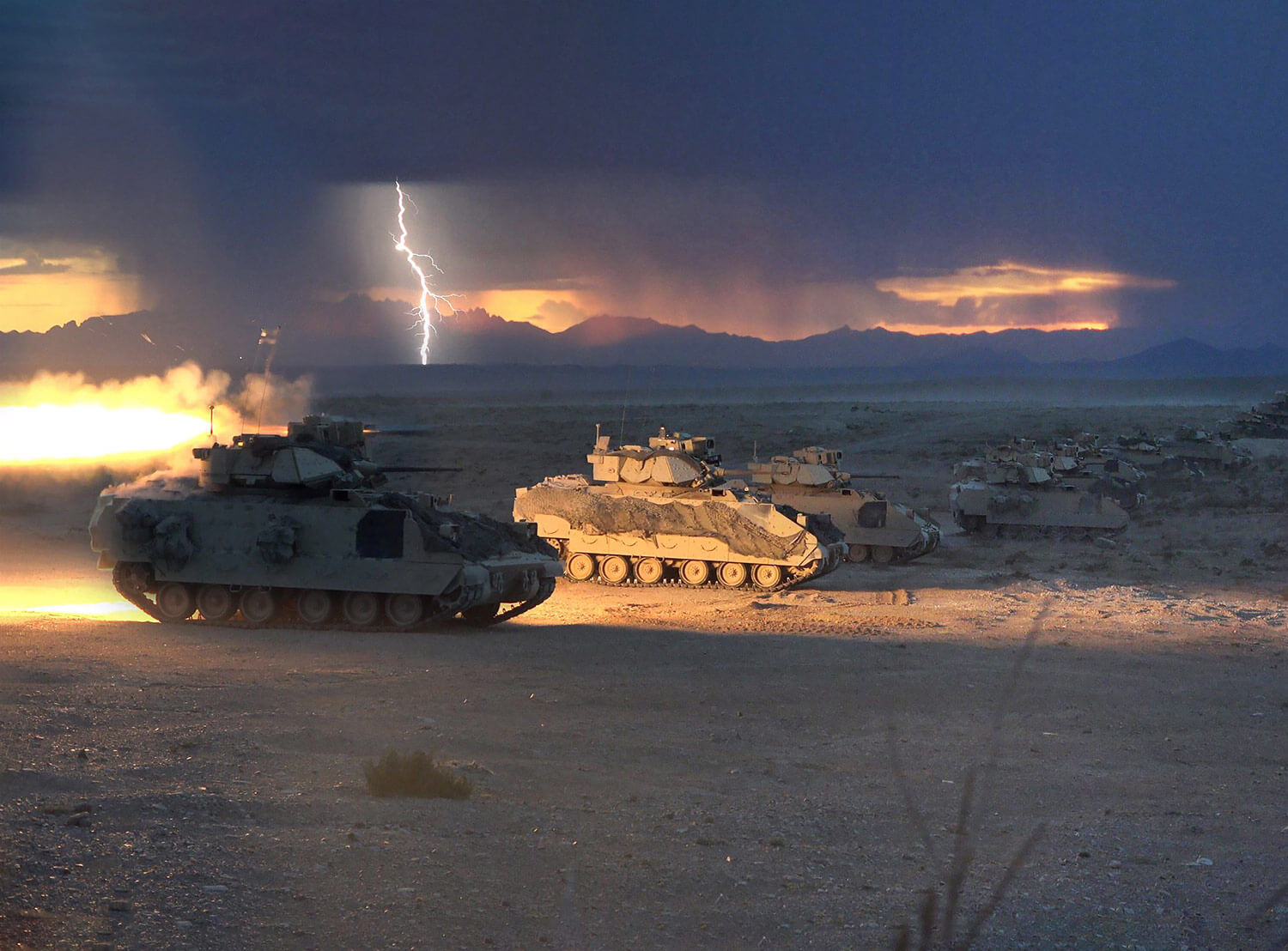 Lightning strikes as Bradley Fighting Vehicles from the 1st Battalion, 150th Cavalry Regiment of the 30th Armored Brigade Combat Team, fire tube-launched, optically tracked, wire-guided (TOW) missiles during a Combined Arms Live Fire Exercise (CALFEX) at Fort Bliss, Texas, in August 2018. This CALFEX is part of the Army National Guard’s eXportable Combat Training Capability program, an instrumented brigade field training exercise designed to certify platoon proficiency in coordination with First Army. North Carolina Army National Guard Photo by SSG Brendan Stephens