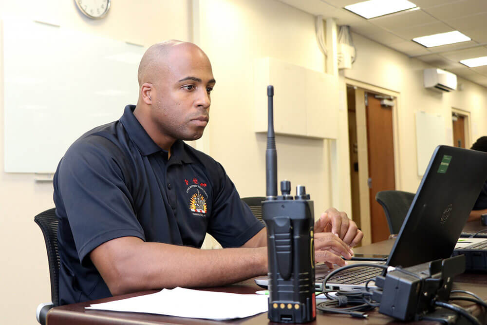 SSG Rayshod Thompson, administrative noncommissioned officer, 33rd Civil Support Team (CST), District of Columbia Army National Guard, monitors CST member activity from a workstation in the Joint Operations Center of the D.C. Armory during the 2018 MLB All-Star Game. D.C. Army National Guard photo by SPC Kevin Valentine