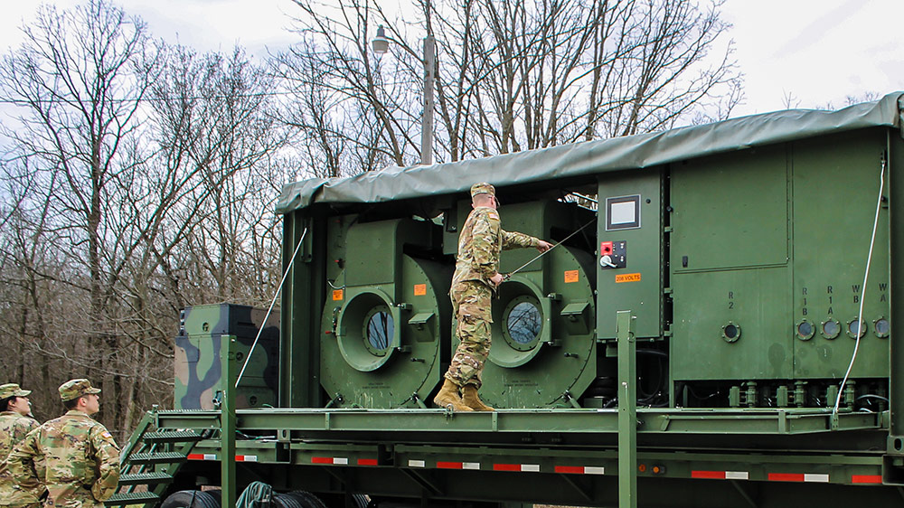 Soldiers with the 126th Quartermaster Field Services Company set up a laundry-systems trailer during their annual training event this past April at Marseilles Training Center in Marseilles, Ill. Photo courtesy U.S. Army